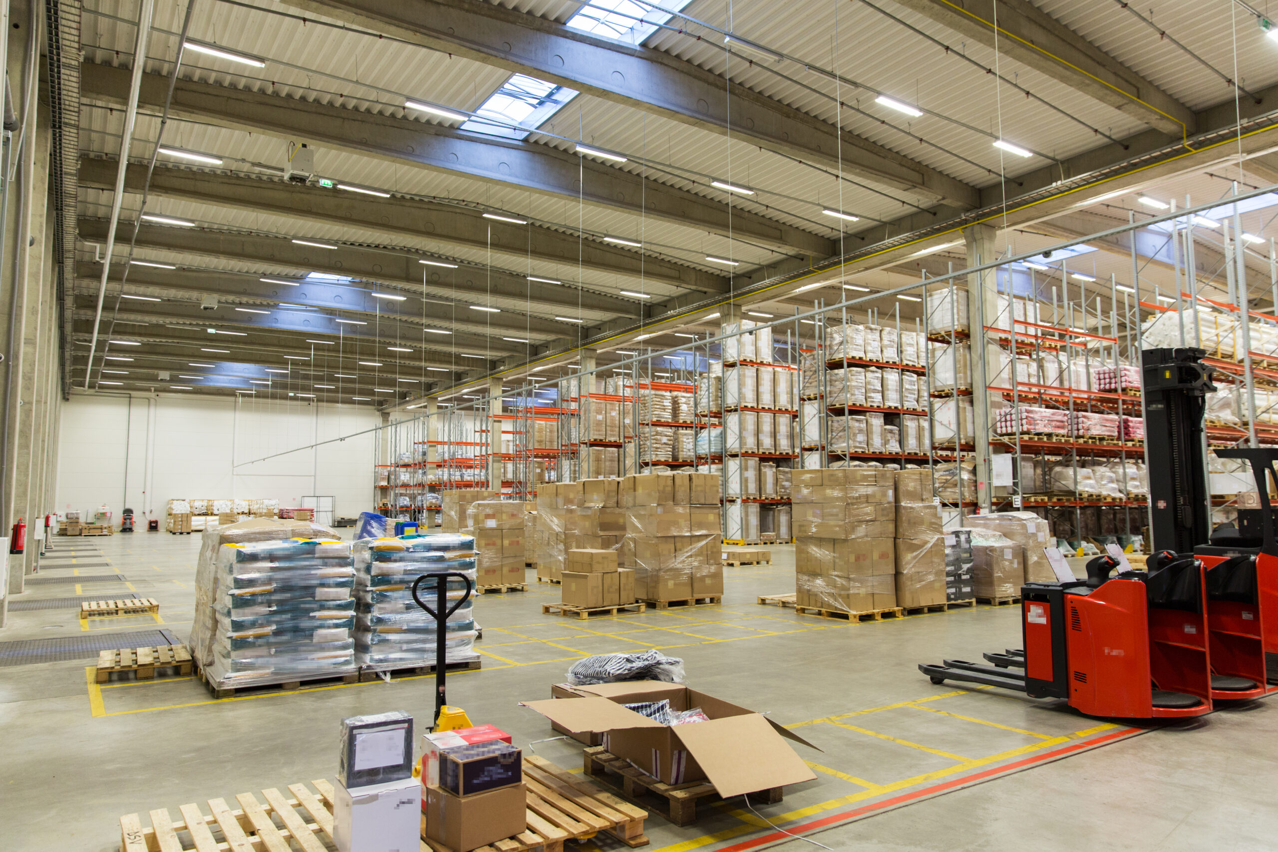 forklift loader and cargo boxes at warehouse